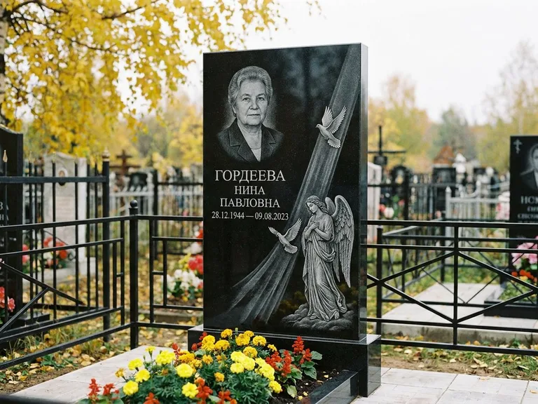 Памятник с гравировкой ангела — гравировка ангела с голубем по диагонали стелы, работа «Гордеева» в Сургуте